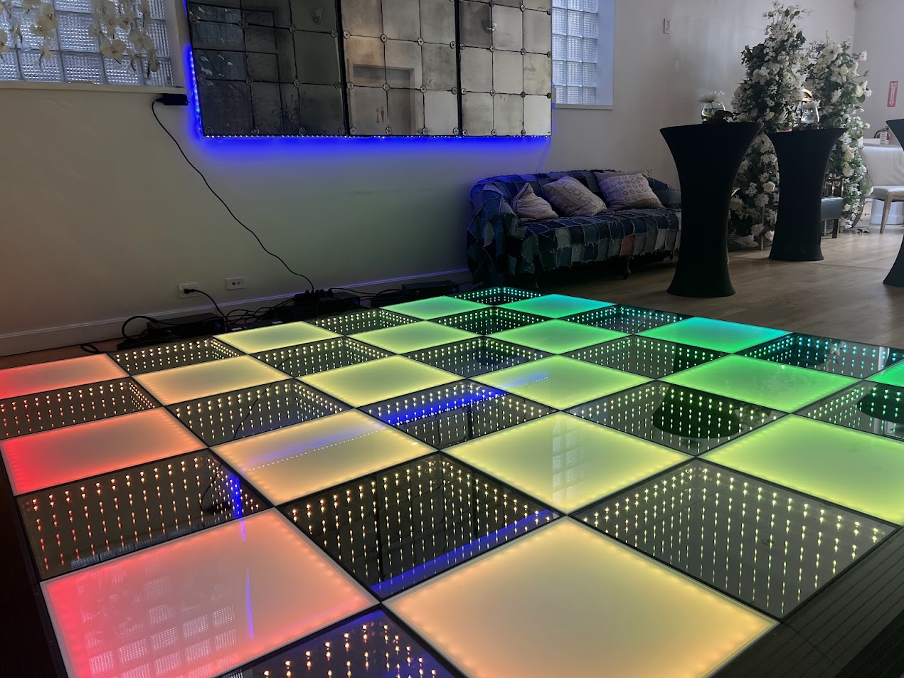 Illuminated LED dance floor glowing in multiple colors